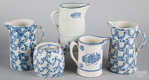 Five blue spongeware pitchers 19th c.