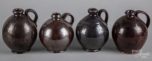 Four small redware ovoid jugs