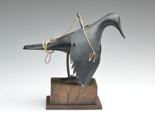 Full size wooden crow with flapping metal wings and metal legs.