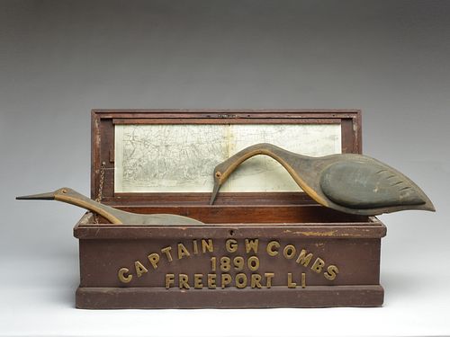 Old sea chest with a map of Long Island under the lid and a set of crane decoys, four with stakes, carved by George Combs, Sr. in 1999.