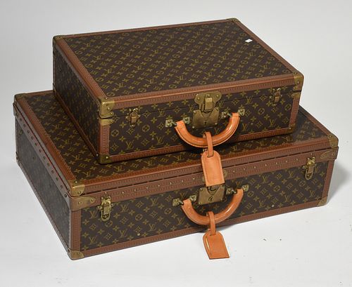 Two Louis Vuitton hard sided suitcases
