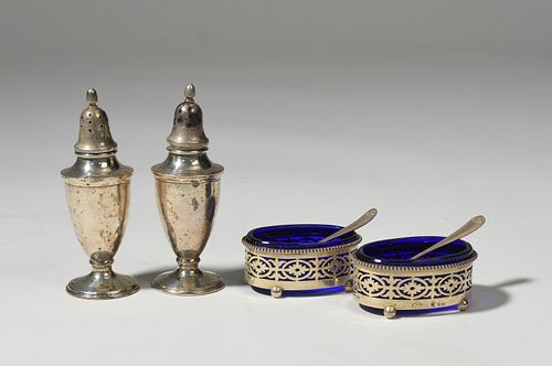 Two pair of salts-shakers and open salts with spoons