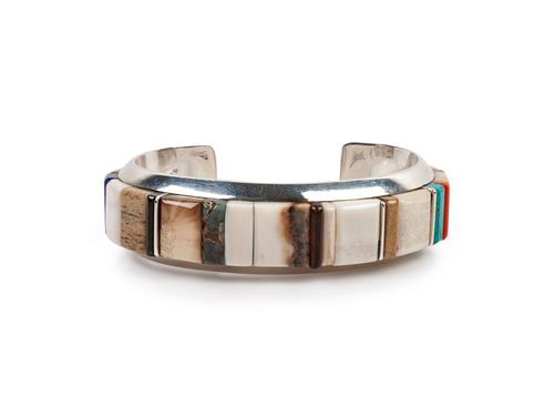 Wes Willie
(DINE, B. 1957)
Silver Cuff Bracelet with Turquoise, Coral, and Lapis Cobblestone Inlay