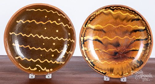 Two Stahl slip decorated redware chargers