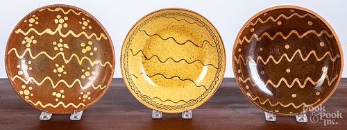 Two Stahl slip decorated redware plates, etc.