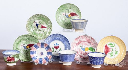 Group of mismatched spatter cups and saucers