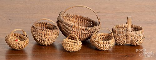 Six miniature baskets