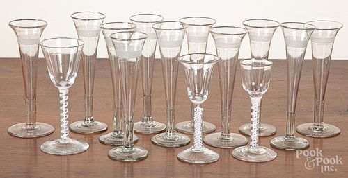 Thirteen glass champagne flutes, 7 3/4" h.