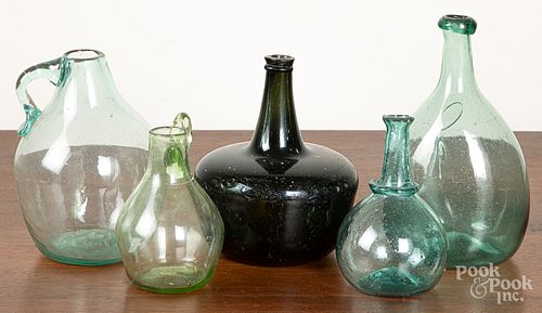Five early blown olive and aqua glass bottles