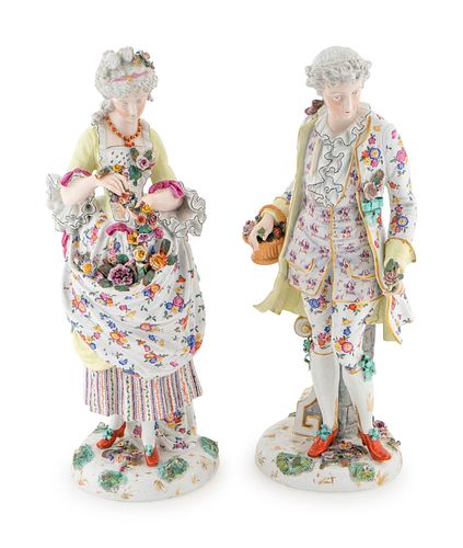 A Pair of German Porcelain Figures Height 19 1/4 inches.
