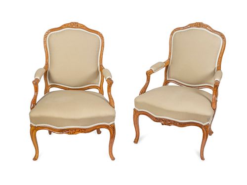 A Pair of Louis XV Style Oak Fauteuils Height 37 inches.