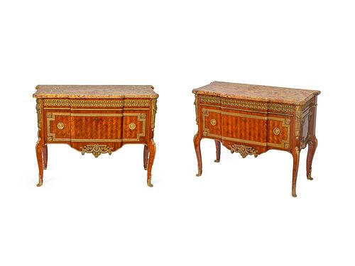 A Pair of Transitional Style Gilt Bronze Mounted Parquetry Commodes Height 34 1/2 x width 43 3/4 x depth 18 1/2 inches.