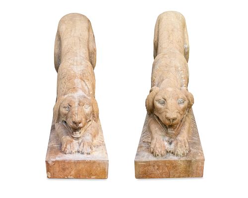 A Pair of Carved Marble Crouching Dogs Height 26 X width 10 X depth 48 inches.