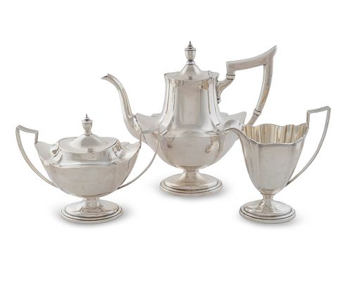 An American Silver Three-Piece Tea Service
Height of teapot 10 x length 10 3/4 x width 5 inches.