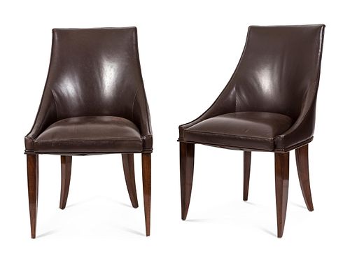 A Set of Ten French Art Deco Leather-Upholstered Rosewood Dining Chairs
Height of seat 17 x width of seat 20 inches; height overall 34 inches.