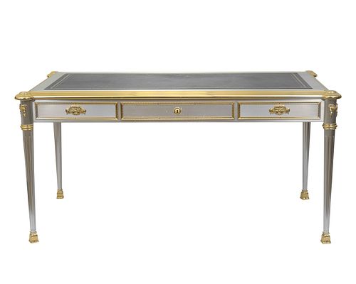 A Louis XVI Style Brass Mounted Silvered Metal Bureau Plat
Height 30 3/4 x width 62 x depth 34 inches.