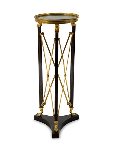 A French Empire Style Gilt Bronze and Ebonized Marble Top Pedestal Table
Height 34 1/2 x diameter 13 7/8 inches.
