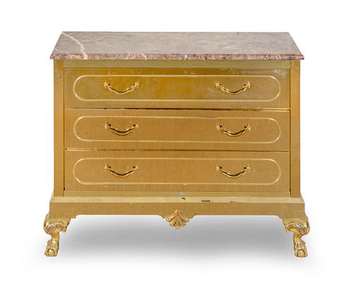 A Hollywood Regency Brass and Marble Top Chest of Drawers
Height 36 1/4 x width 46 1/2 x depth 18 1/2 inches.