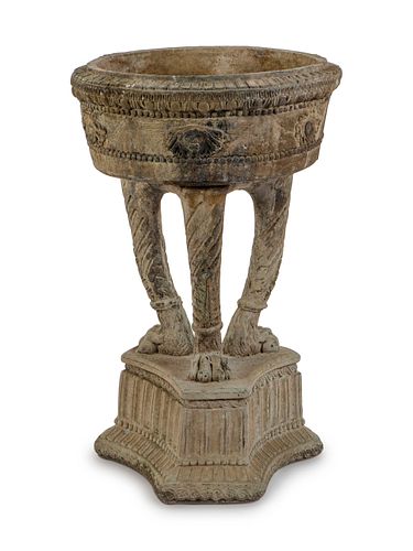 A Carved Stone Garden Jardiniere on a Tripartite Base
Height 30 1/4 x diameter 18 3/4 inches.