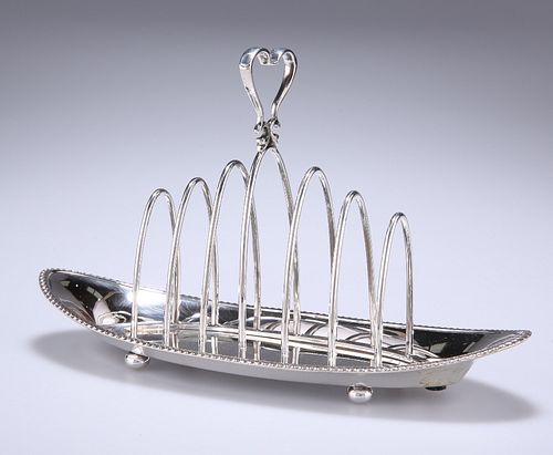 AN EDWARDIAN SILVER TOAST RACK
 by Joseph Rodgers 
