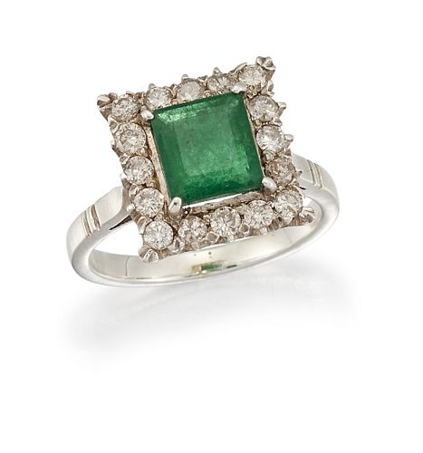 AN EMERALD AND DIAMOND CLUSTER RING
 The square-cu