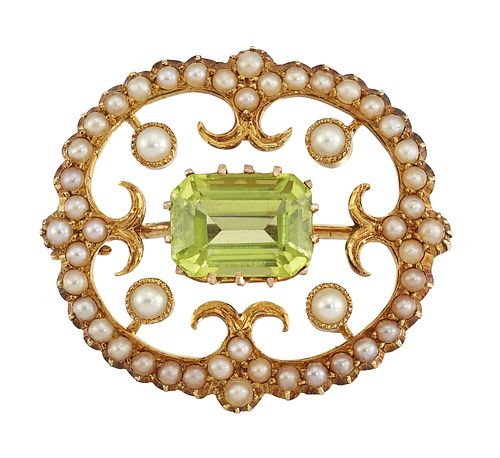 A PERIDOT AND SEED PEARL BROOCH
 The lobed openwor