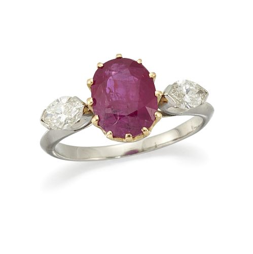 A RUBY AND DIAMOND RING
 The claw-set oval-cut rub