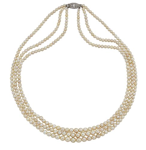 A NATURAL PEARL NECKLACE WITH A DIAMOND-SET CLASP
