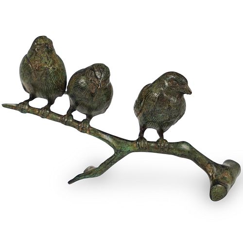 Bronze Birds Perched On a Branch