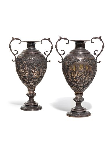 A Pair of Persian Silvered Copper Vases
Height 19 1/2 inches.