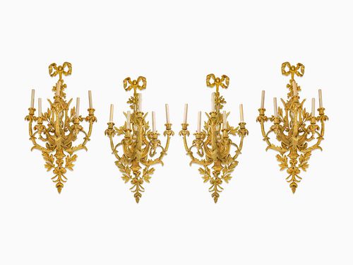 A Set of Four Louis XV Style Gilt-Bronze Five-Light Sconces
Height 37 x width 19 x depth 13 1/2 inches.