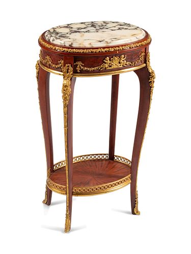 A Louis XV Style Gilt-Bronze-Mounted Stand
Height 31 x width 17 1/2 x depth 13 inches.