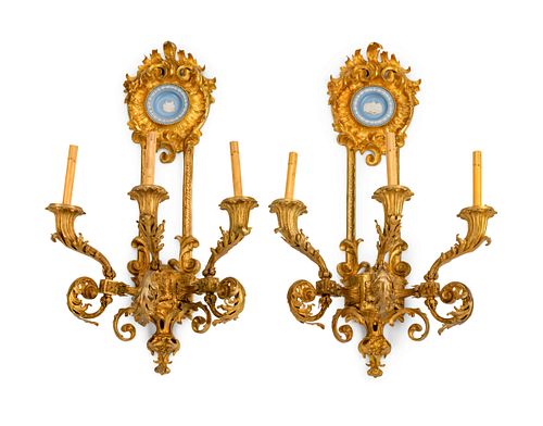 A Pair of Louis XV Style Blue and White Jasperware-Mounted Gilt-Bronze Three-Light Sconces
Height 35 x width 23 x depth 13 inches.