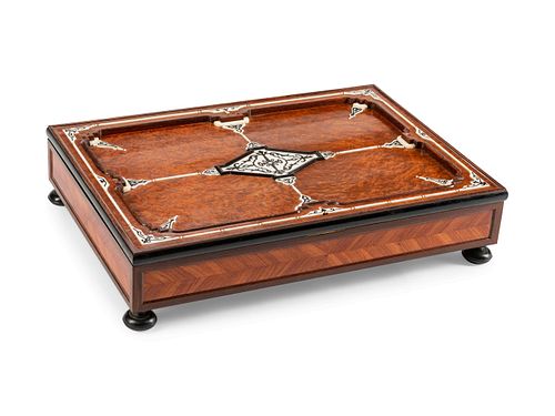A French Inlaid Burlwood Traveling Desk
Height 7 x length 30 1/2 x depth 22 inches.