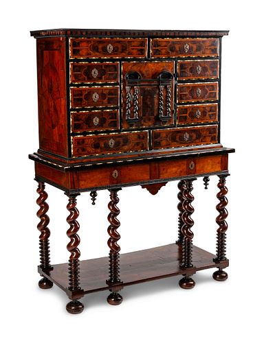 A Dutch Baroque Style Marquetry Cabinet on Stand
Height 66 1/2 x width 48 1/2 x depth 21 inches.