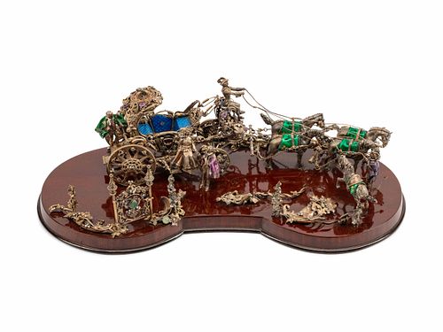 A Continental Jeweled Silver and Enamel Model of a Horse-Drawn Coach
Height 8 x length 25 1/2 x depth 13 inches.