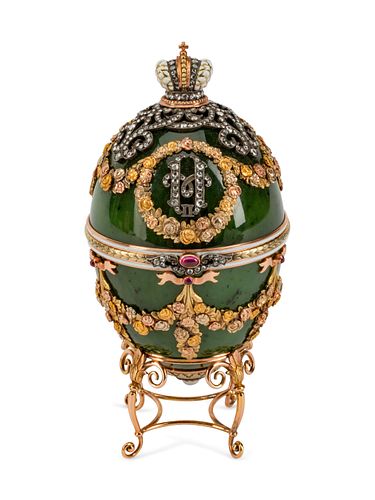 A Diamond and Gold-Mounted  Enamel and Jadeite Egg
Height 5 x width 2 1/2 inches.