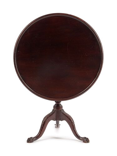 A George III Mahogany Tilt-Top Tea Table
Height 30 1/2 x diameter 33 inches.
