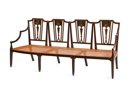 A George III Style Caned and Painted Quadruple Chairback Settee
Height 35 x length 78 x depth 24 inches.