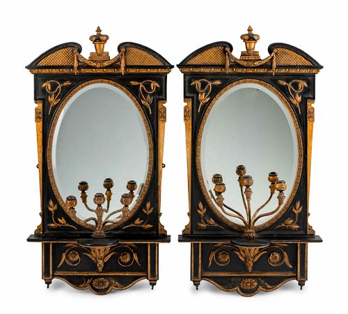 A Pair of English Parcel-Gilt and Ebonized Girandole Mirrors
Height 48 x width 26 x depth 9 inches.