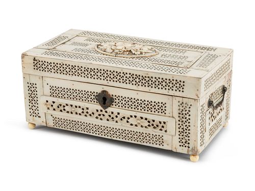 An Anglo-Indian Pierce-Carved Bone Casket
Height 4 x length 9 x depth 7 inches.