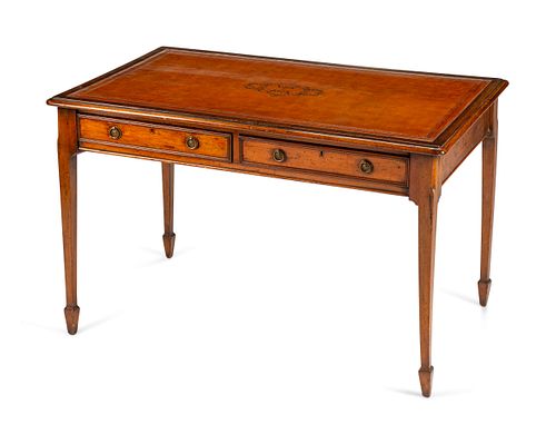 An Edwardian Mahogany Writing Table
Height 30 x length 47 1/2 x depth 30 inches.