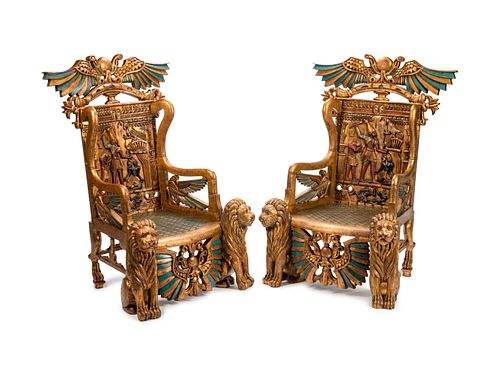 A Pair of Egyptian Revival Style Parcel-Gilt and Polychromed Throne Chairs
Height 54 1/2 x width 34 x depth 31 inches.