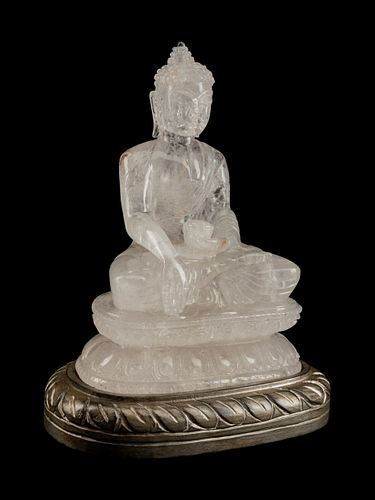 A Chinese Carved Rock Crystal Figure of Buddha
Height 12 1/2 x width 9 1/2 x depth 7 inches.