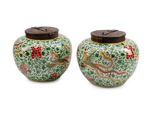 A Pair of Chinese Iron-Mounted Porcelain Jars
Height 11 x diameter 12 inches.