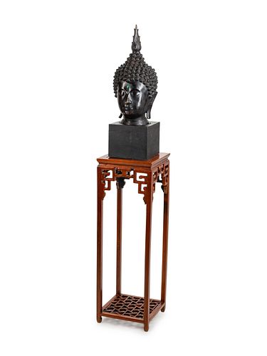 A Large Thai Bronze Head of Buddha
Height overall 90 x width 17 x depth 17 inches.
