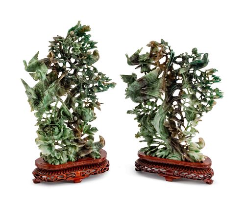 A Pair of Chinese Pierce-Carved Hardstone Models of Birds in Branches
Height 12 x width 9 1/2 inches.
