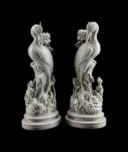 A Pair of Chinese Blanc de Chine Porcelain Crane-Form Candlesticks
Height 22 x width 9 x depth 7 inches.