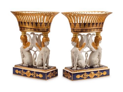 A Pair of Sevres Style Porcelain Figural Corbeilles
Height 22 x length 19 1/2 x depth 10 1/2 inches.