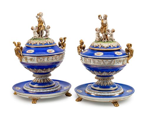A Pair of German Porcelain Tureens, Covers and Stands
Height 21 1/2 x diameter 15 1/2 inches.